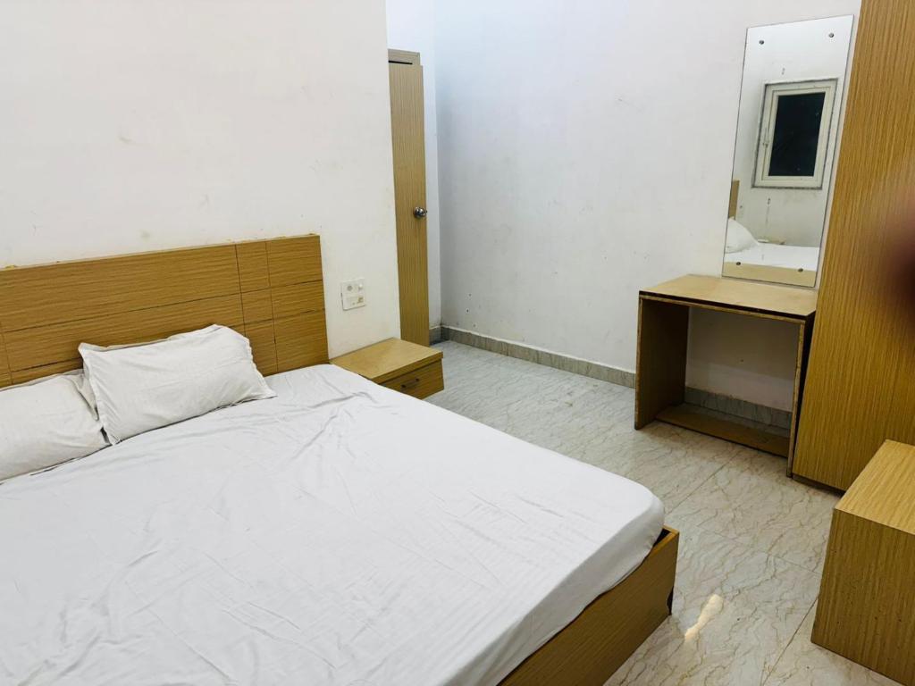 En eller flere senge i et værelse på Hotel Green Valley