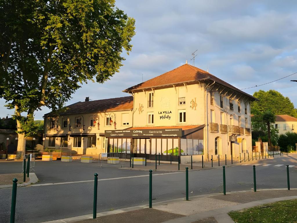 an old building on the side of a street at Villa Milady in Salies-du-Salat