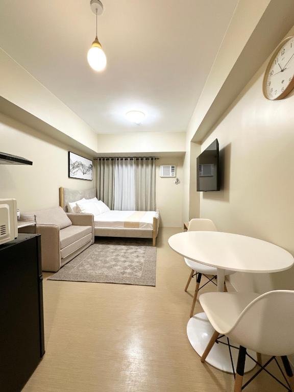 a living room with a couch and a table at Condo in Cagayan de Oro City in Cagayan de Oro