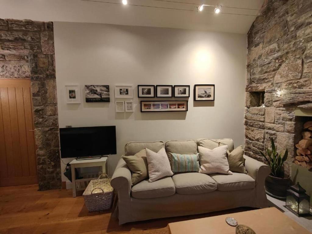 a living room with a couch and a tv at 4Guest-2Bedroom-Wifi-Parking in Deerpark