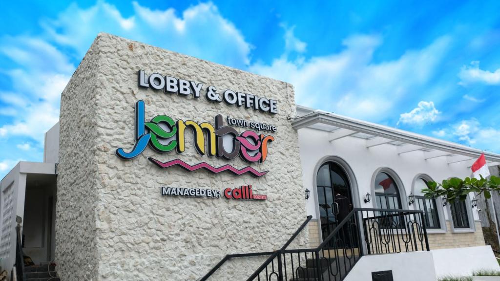 a building with a sign on the side of it at Jember Town Square by Calli Rooms in Wirolegi