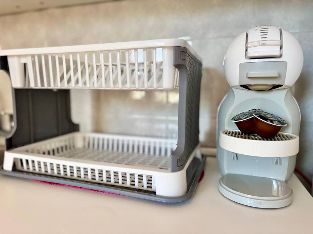 a coffee maker sitting on top of a kitchen counter at Elixir Estate in Antigua