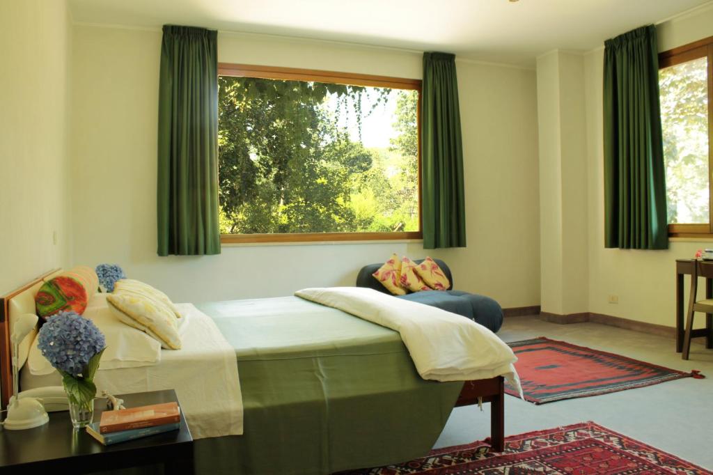 Postel nebo postele na pokoji v ubytování Hotel MariaLetizia