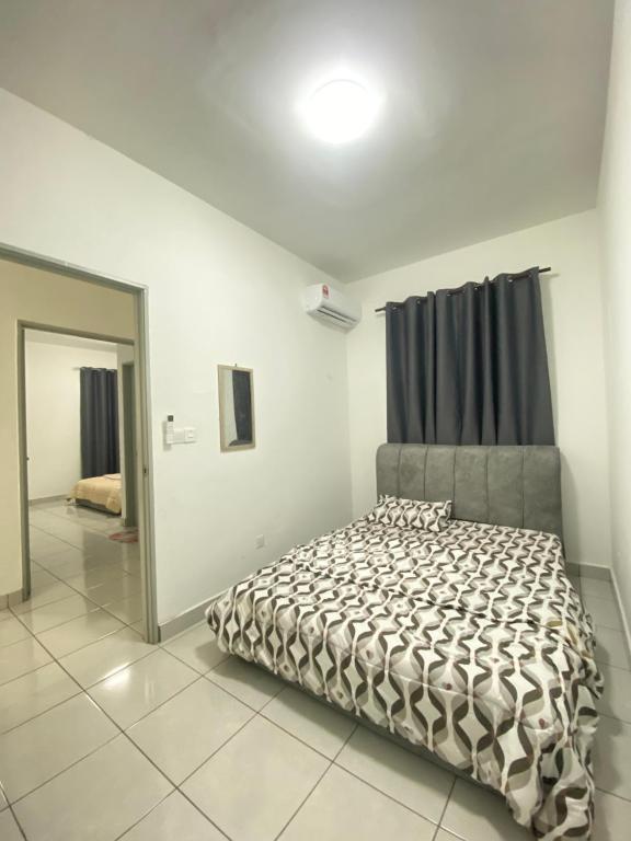 a bedroom with a bed and a mirror at Ai Lee Haven in Papar