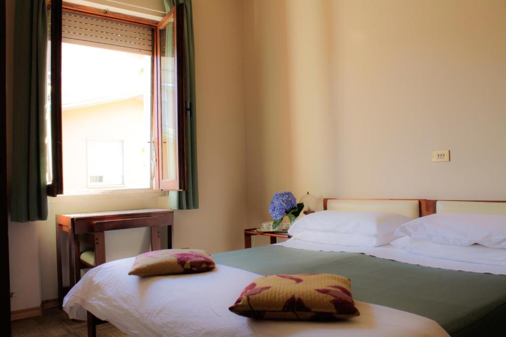 Postel nebo postele na pokoji v ubytování Hotel MariaLetizia