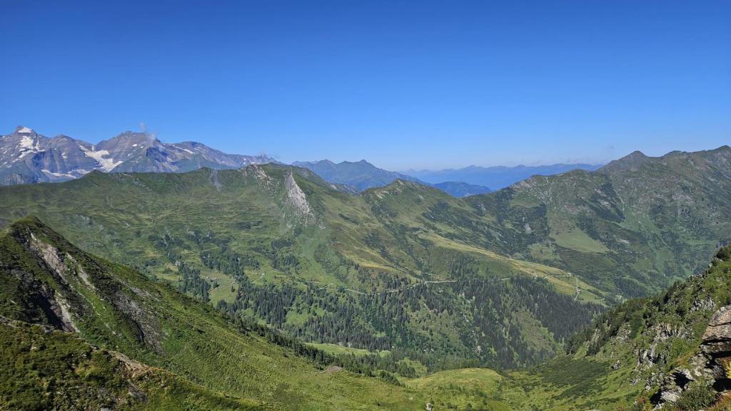 a view of a mountain range with green mountains at Goldberg-Aparts Berg in Seidlwinkl
