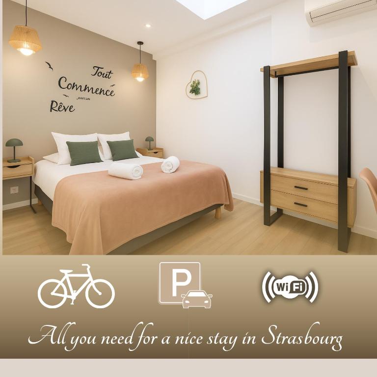 a bedroom with a bed with a bike on the wall at Les Lodges des Forges - Appartements Climatisés in Strasbourg