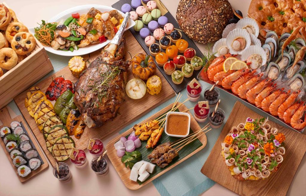 A close overhead presentation of an extensive mixed buffet spread.