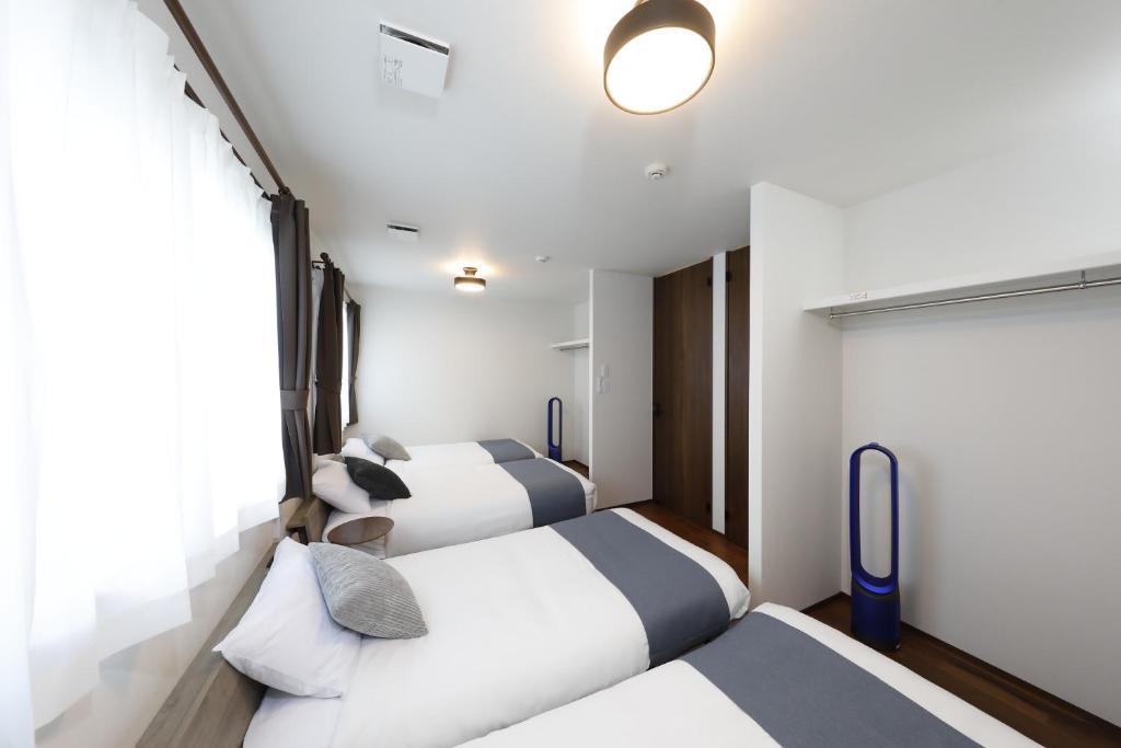 En eller flere senge i et værelse på 北の杜ピリカ輪厚