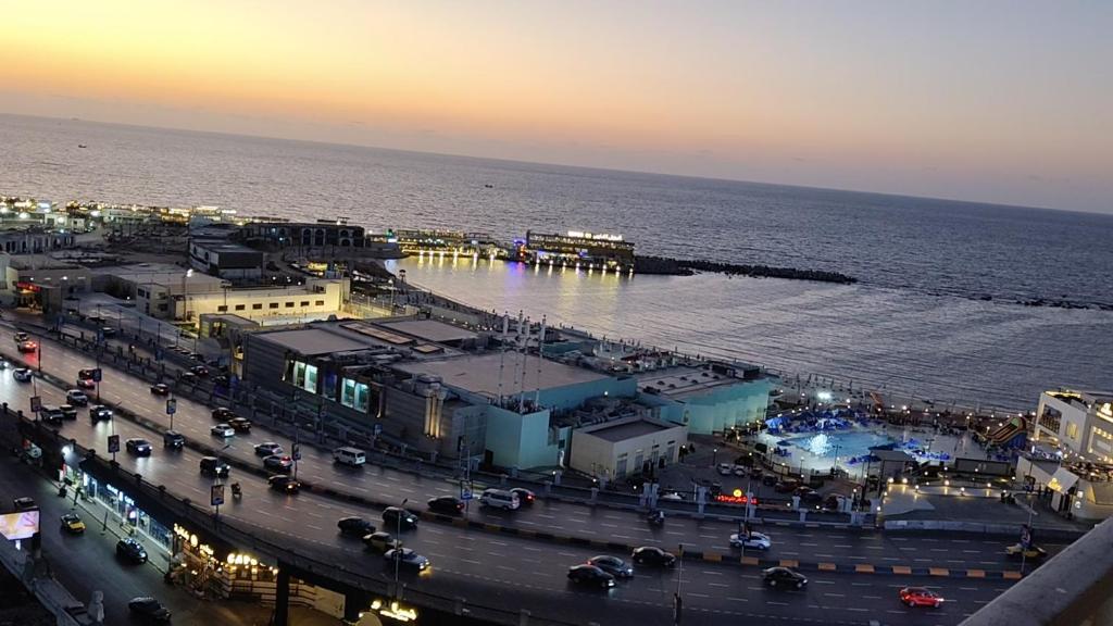 an aerial view of a city with the ocean at شقه على البحر مباشره فى عمارات الظباط مصطفى كامل سيتي اسكوير in Alexandria