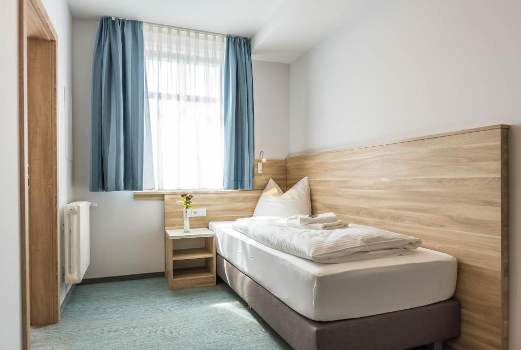Postel nebo postele na pokoji v ubytování Schumanns Garten