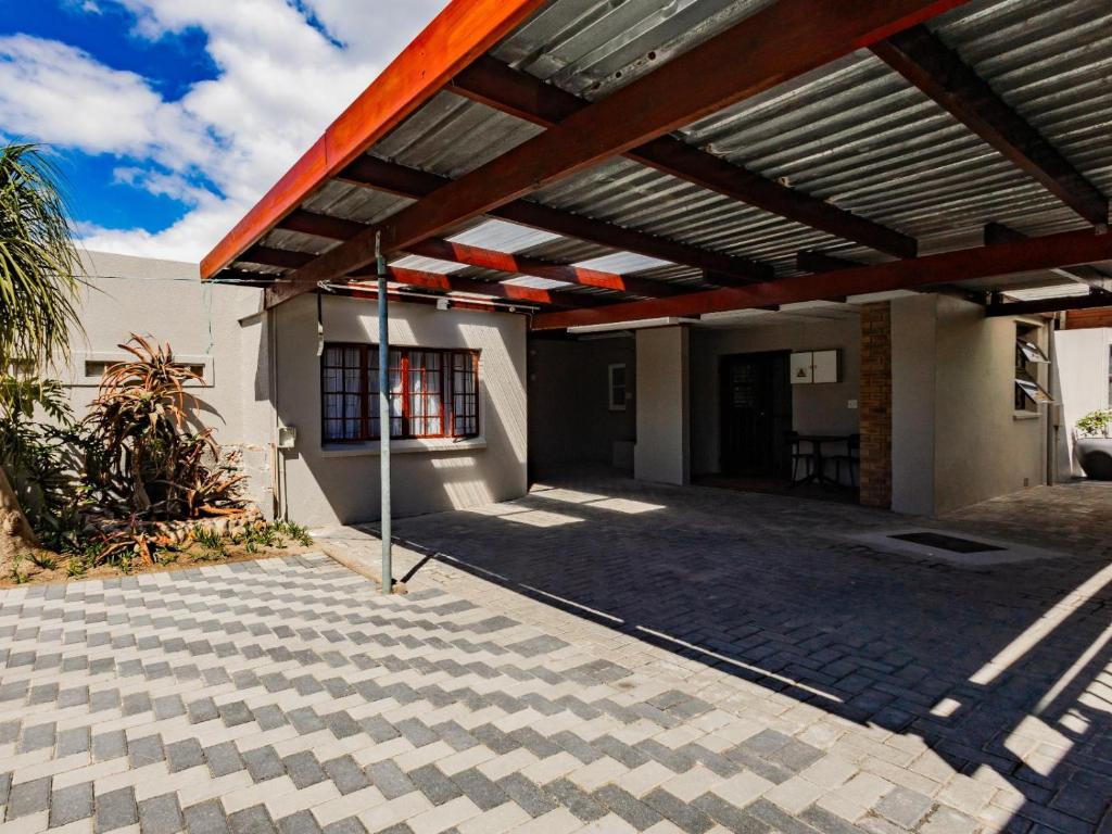 a patio with awning on the side of a building at Urban Oaks in Bellville
