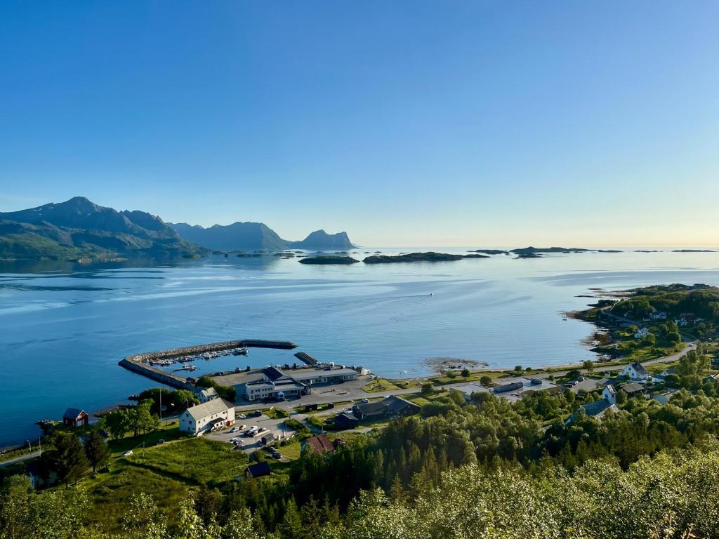 an aerial view of the shoreline of a lake at Yttersia Base in Senja