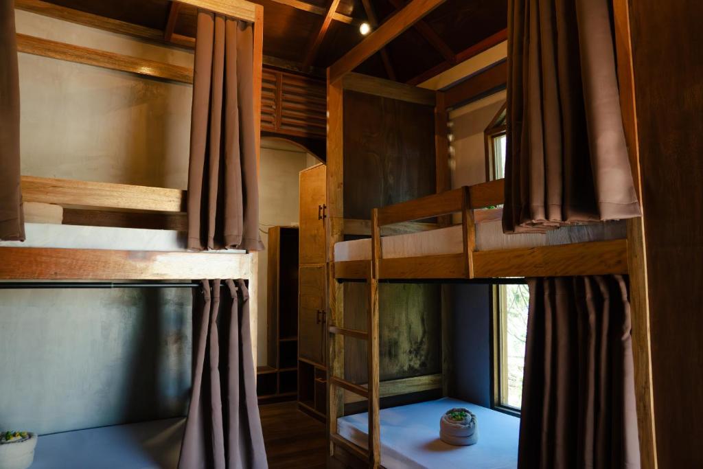 Ένα ή περισσότερα κρεβάτια σε δωμάτιο στο Kayan Siargao