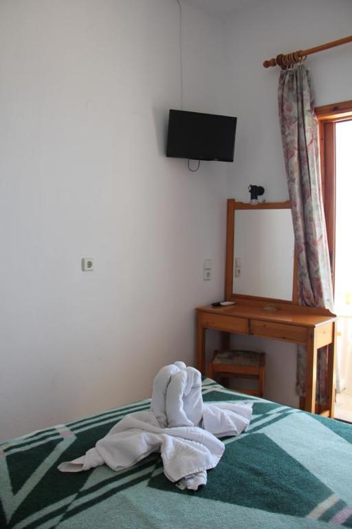 Postel nebo postele na pokoji v ubytování Hotel Alkyon