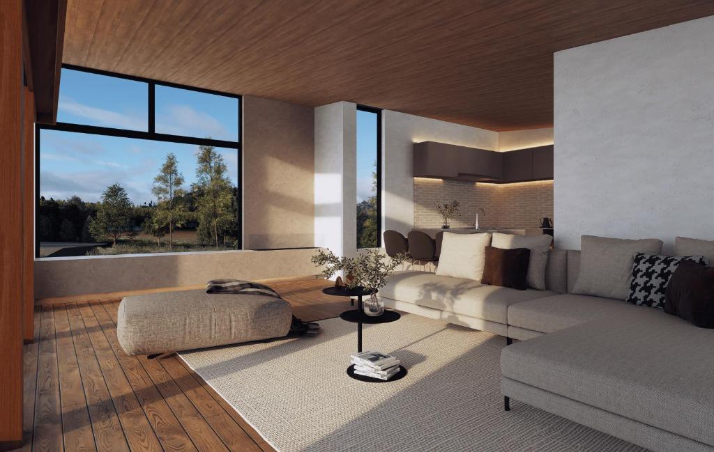 a living room with a couch and a large window at Amber Echoland MrT by Jade Group in Hakuba