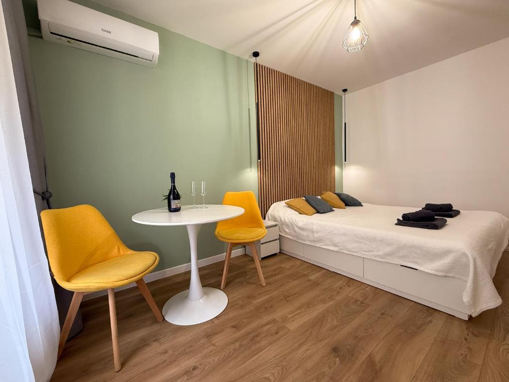 Un pat sau paturi într-o cameră la Piata Unirii Apartment