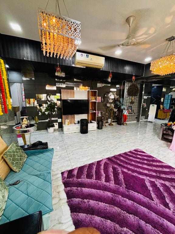 a large purple rug on the floor of a store at Satymev Serene flats in Ahmedabad