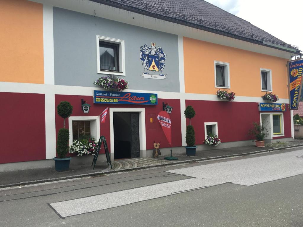 a building with a sign on the side of it at Leitner in Wald am Schoberpaß