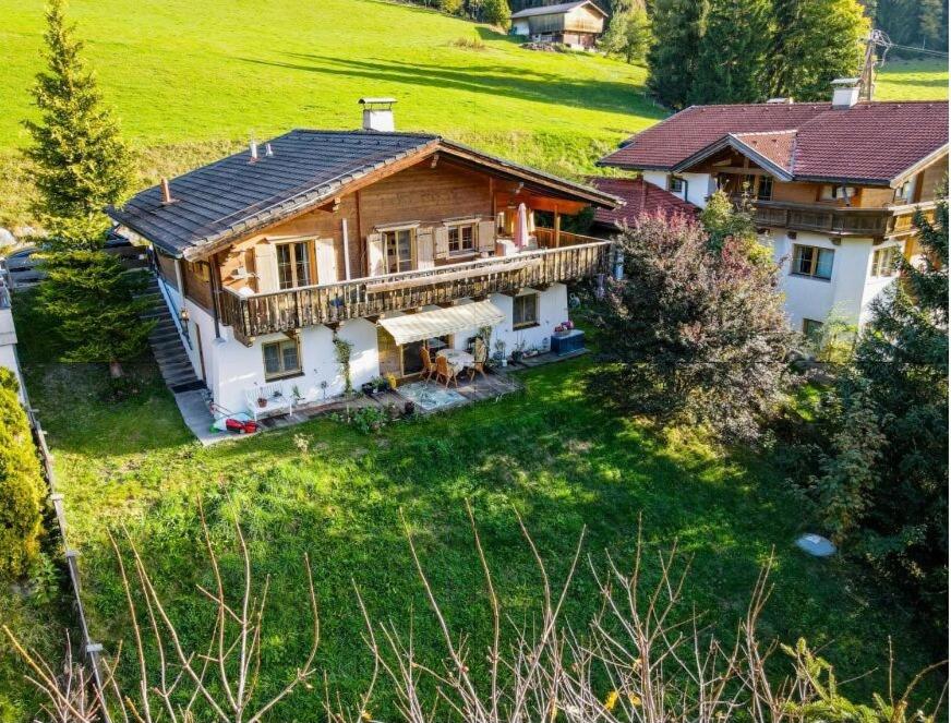 an aerial view of a house in a field at Almrose Zauber by Alpenchalet Almrose in Oberau