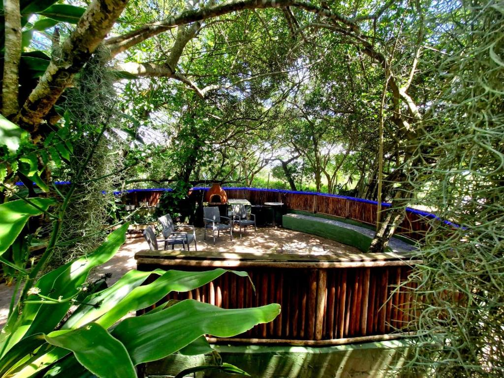 a hot tub in the middle of a forest at Shengeza Lake Lodge in KuShengesa