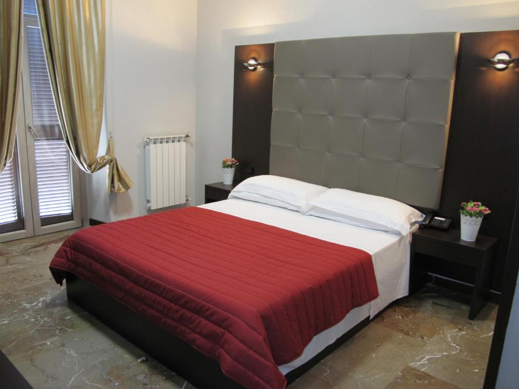 Hotel d'Este tesisinde bir odada yatak veya yataklar