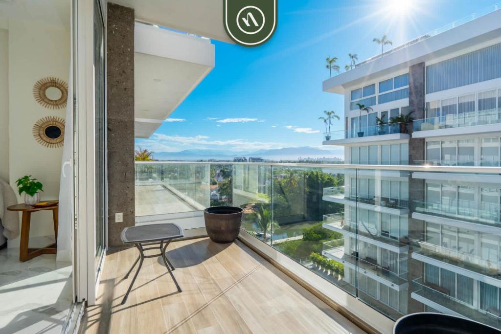 a balcony with a view of a building at 3BR Condo Right Next to the Beach - Pool - Palapa in Nuevo Vallarta