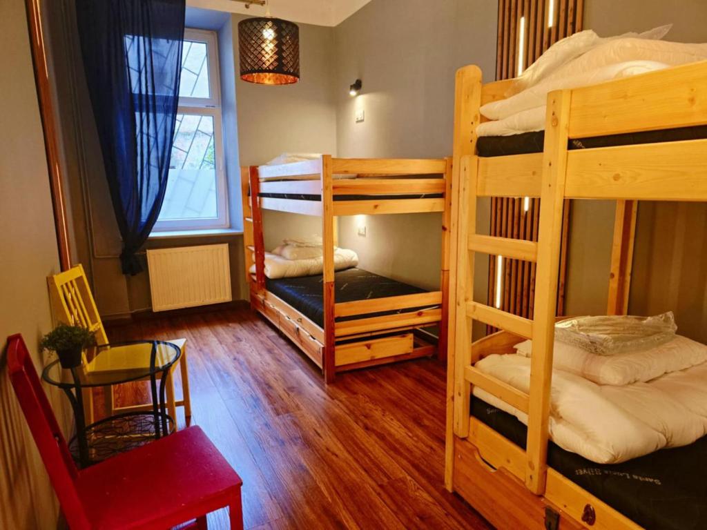 Postel nebo postele na pokoji v ubytování Greg&Tom Party Hostel