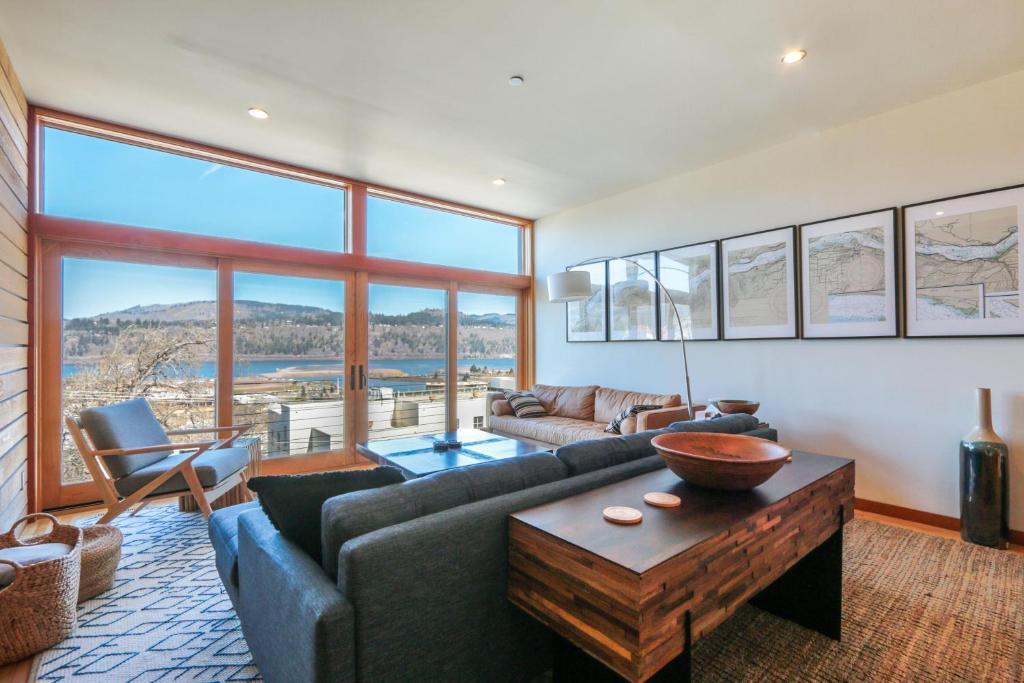 a living room with a couch and a table at ALOFT in Hood River