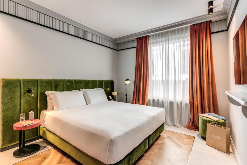 Ένα ή περισσότερα κρεβάτια σε δωμάτιο στο Hotel Della Prassede