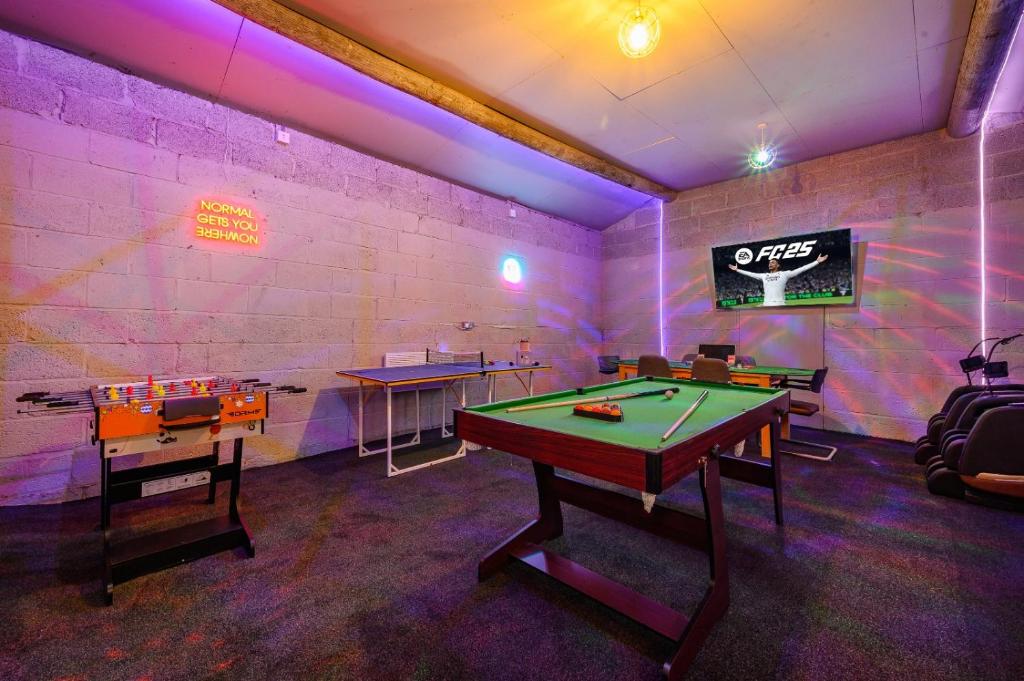 a ping pong room with a pool table in it at *C.sani* Setup for your most relaxed & amazing stay + Free Parking + Free Fast WiFi * in Leeds