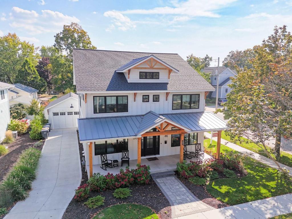 an aerial view of a house with a driveway at expERIEnce in South Haven