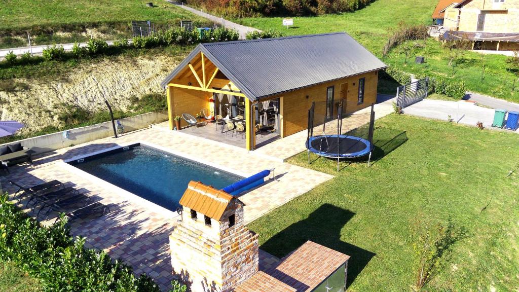 an overhead view of a tiny house with a pool at Holiday House Novus in Selno