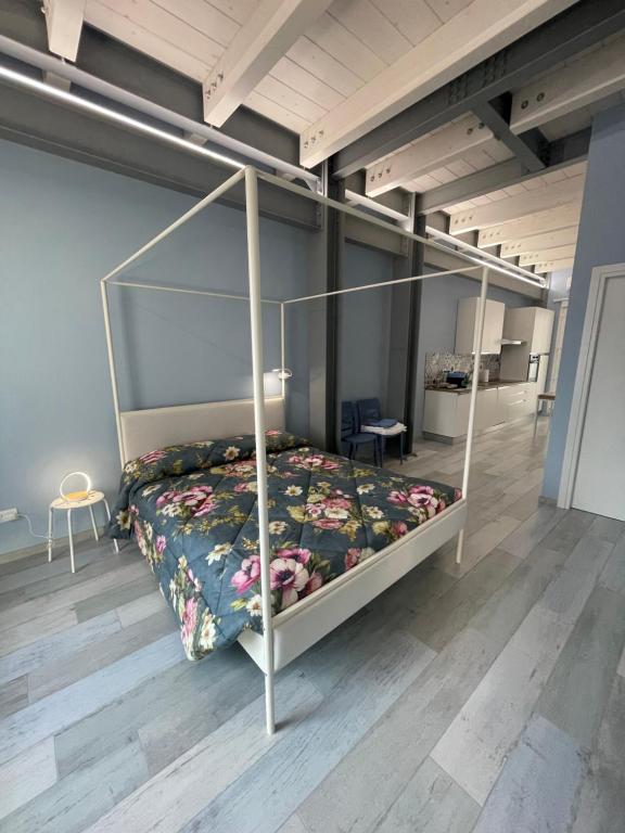 a bedroom with a bed with a metal bed frame at Casa Giulietta - ombrellone e 2 lettini inclusi in Porto SantʼElpidio