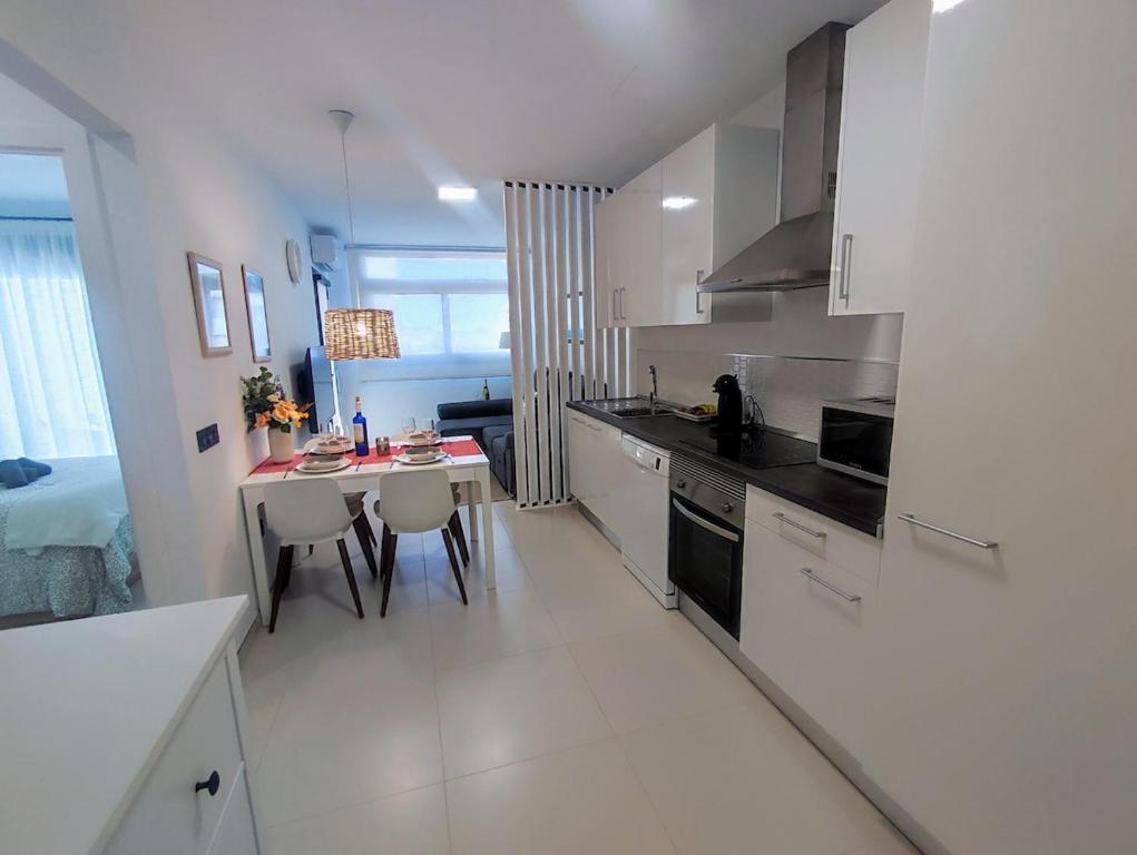 a kitchen with a table and a dining room at Korner in Adeje