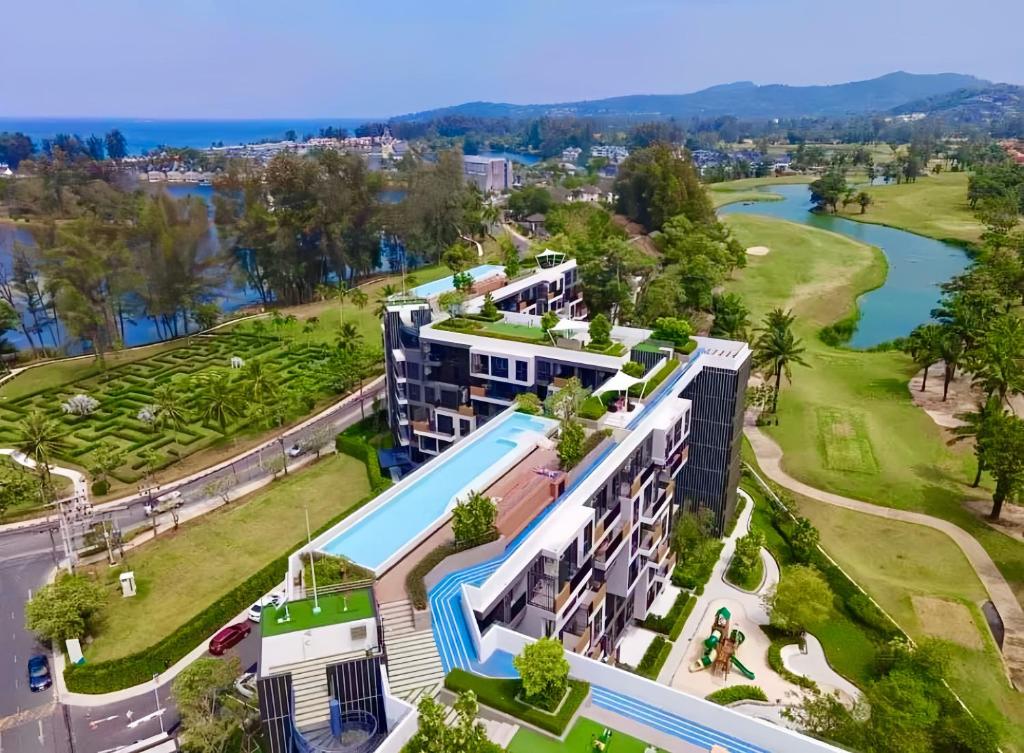 an aerial view of a resort with a swimming pool at BangTao Rooftop Seaview Laguna Skypark Condominium in Laguna Phuket