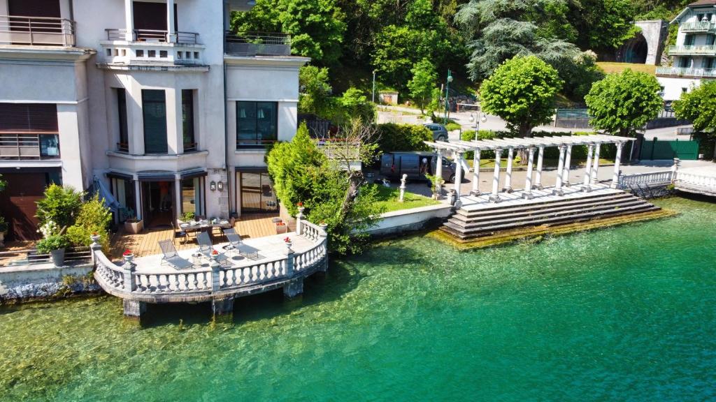 an aerial view of a house on the water at Le Panoramique Rivage - Terrasse privative in Duingt