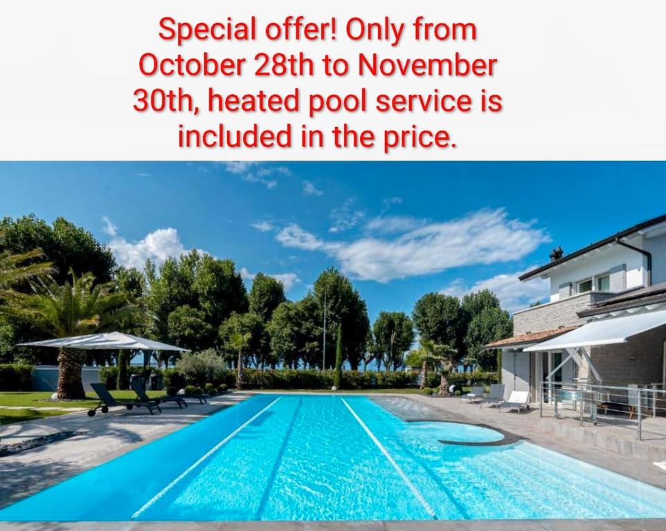 an image of a swimming pool in a house at Villa Sirmione Front Lake in Sirmione