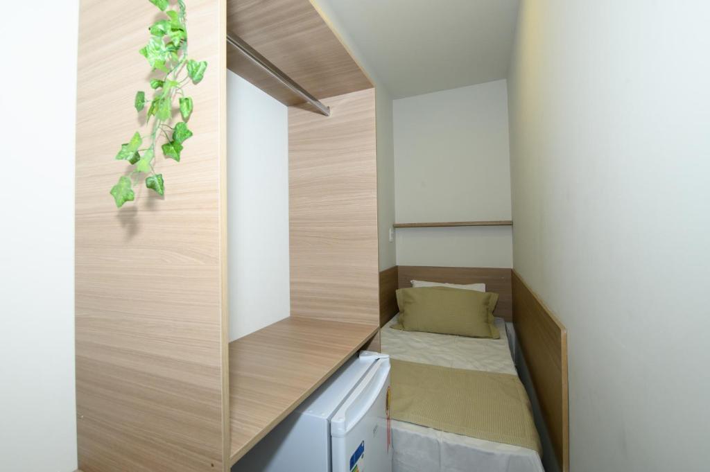 Ένα ή περισσότερα κρεβάτια σε δωμάτιο στο Hotel Cápsula Residenziale
