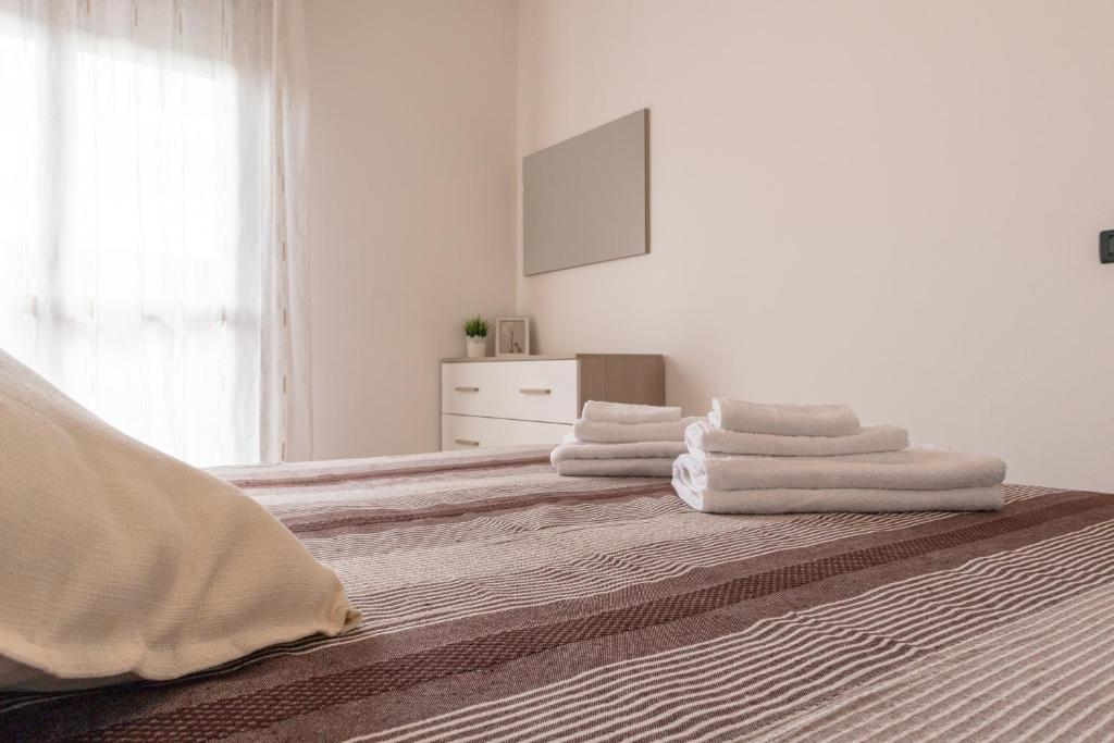 Ένα ή περισσότερα κρεβάτια σε δωμάτιο στο Mira Venice Apartment
