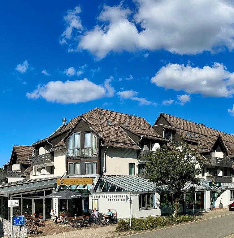 a large building with brown roofs on a street at Hotel Walpurgishof in Hahnenklee-Bockswiese