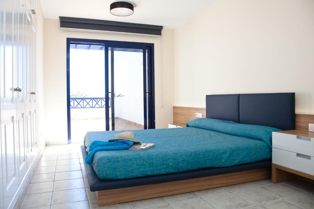 Postel nebo postele na pokoji v ubytování Villas Coloradas