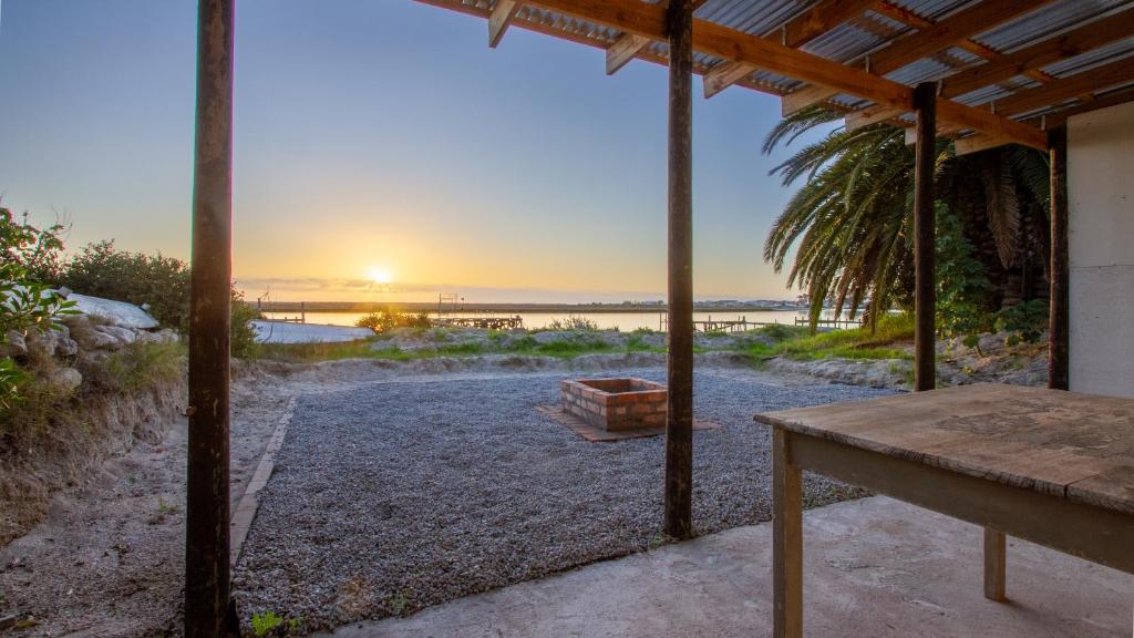 a view of the beach from the porch of a house at Bergriver Nest in Velddrif
