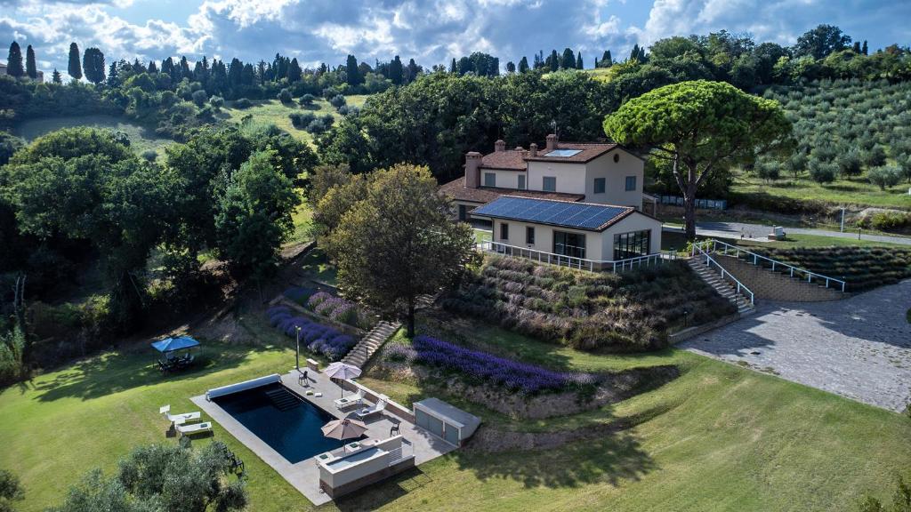 an aerial view of a house with a swimming pool at Casale Astralis 13 by Marche Holiday Villas in Saltara