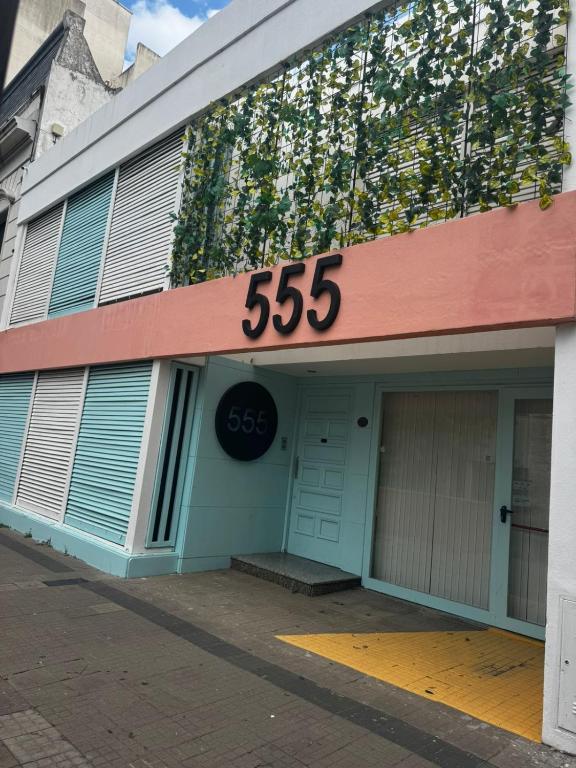 a building with a sign that says on it at Hostel 555 in La Plata