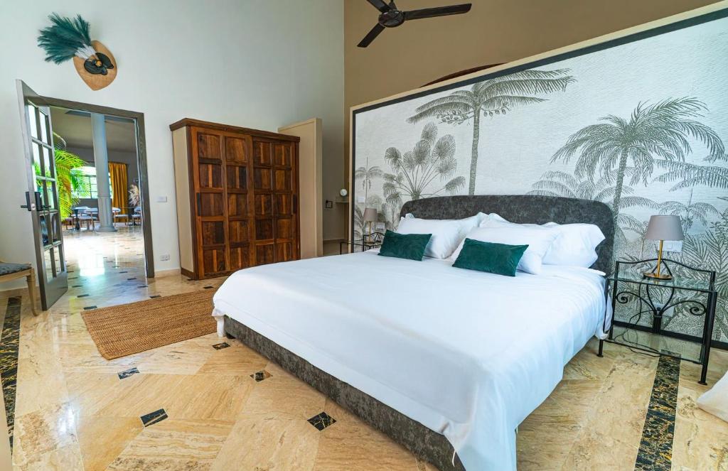 Ένα ή περισσότερα κρεβάτια σε δωμάτιο στο La Pala Suites