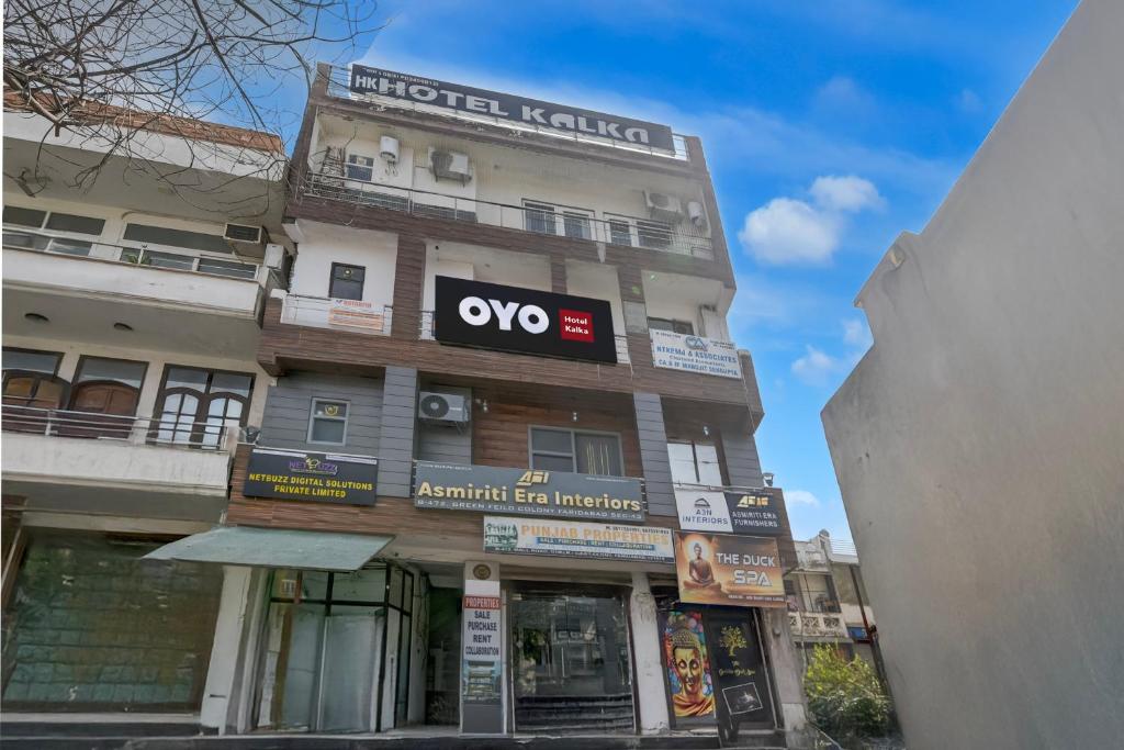 a building with an ovo sign on the side of it at Hotel O Kalka in Indraprast