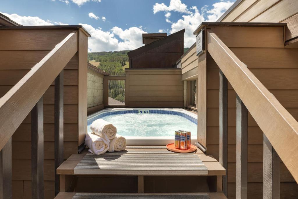 a plunge pool on a deck with a hot tub at Vail 21 - CoralTree Residence Collection in Vail