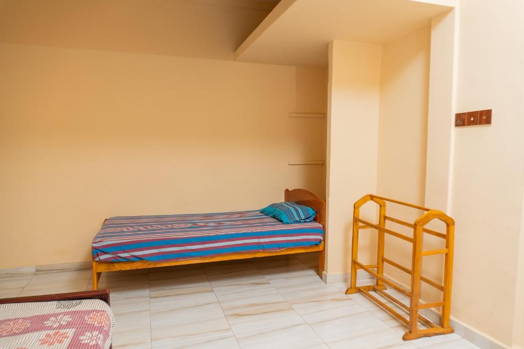 Ένα ή περισσότερα κρεβάτια σε δωμάτιο στο Cheran Villa