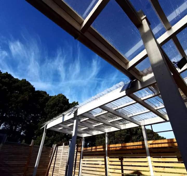 a roof of a tennis court with the sky in the background at Cabañas fariña llanquihue in Llanquihue
